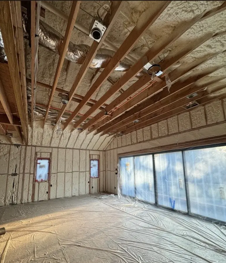 Interior walls and ceiling insulated with spray foam during new construction in Los Altos